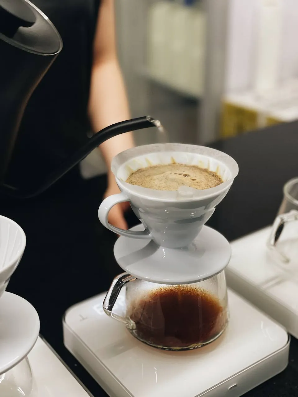 Pour-over brewers lined up on the Parallel coffee bar