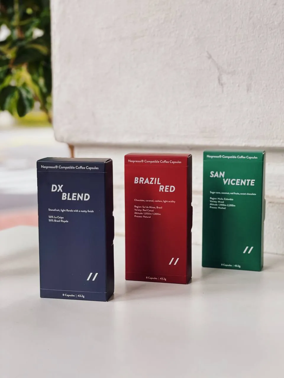 Parallel coffee boxes lined up on a shelf